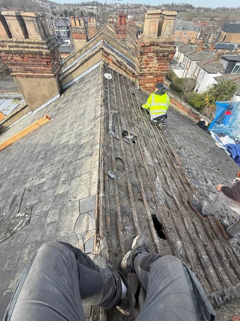 Stripping out a worn slate roof